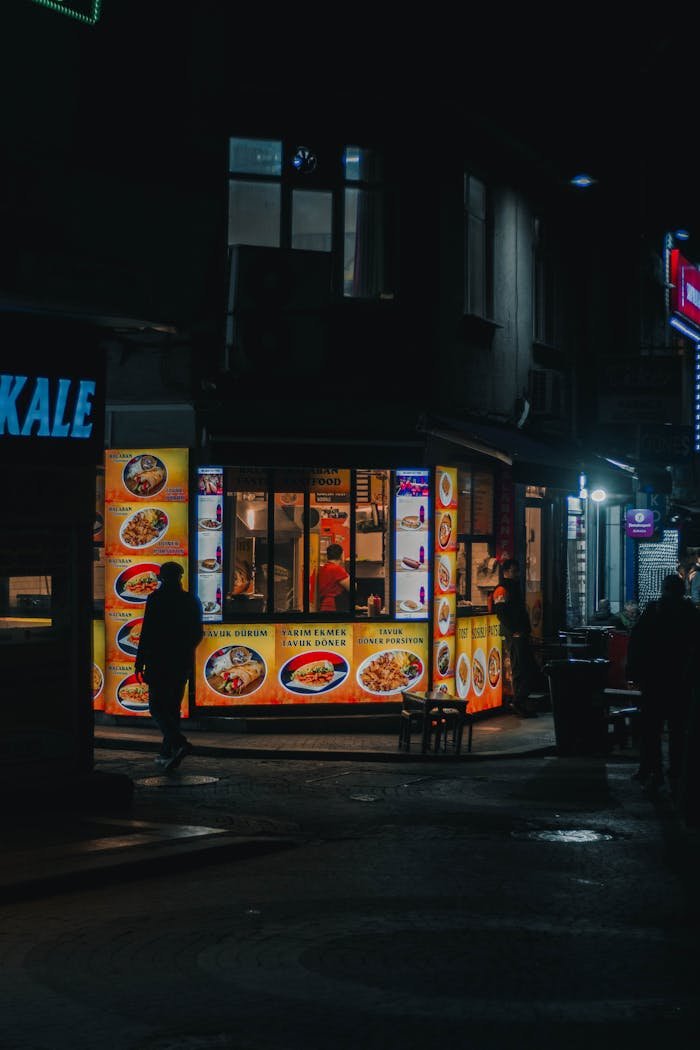 Atmospheric night scene of a street food stall in Istanbul, capturing vibrant city life.